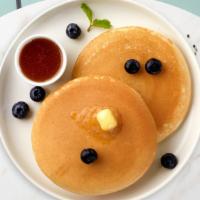 Blueberry Pancakes · Fluffy pancakes cooked with care and love served with blueberries, butter and maple syrup. S...