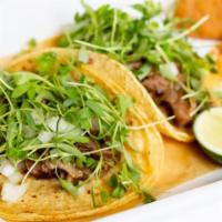 Beef Suadero · brisket, taquera-style tortilla, salsa macha, avocado, onion, cilantro