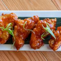 Wings (4) · Spicy. Fried marinated chicken wings coated with enough honey sweet chili sauce to make your...
