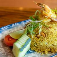Pineapple Fried Rice · Gluten-free. A perfect combination of fried rice with shrimps, chicken, asian sausage, pinea...