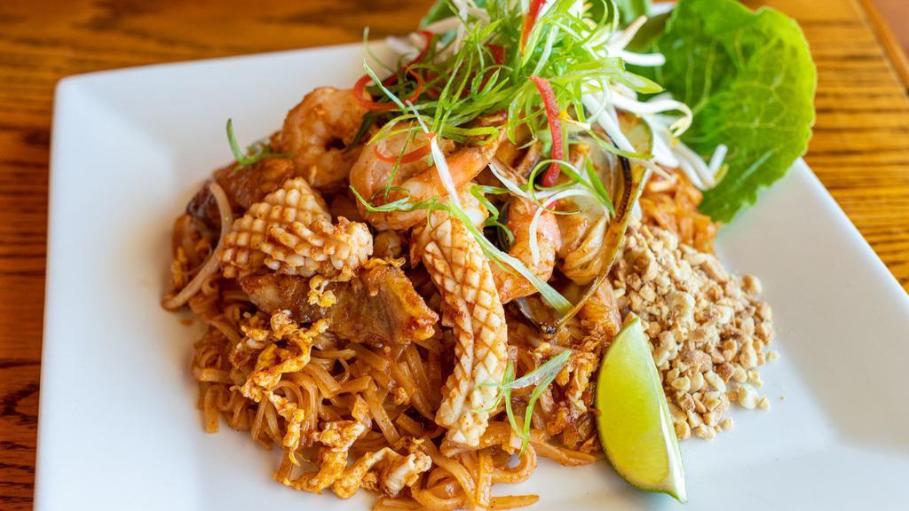 Pad Thai · Vegetarian, Gluten-free. Traditional Thai dish of stir-fried thin rice noodles, Chinese chives, bean sprouts, crushed peanuts & eggs in savory and sweet tamarind sauce