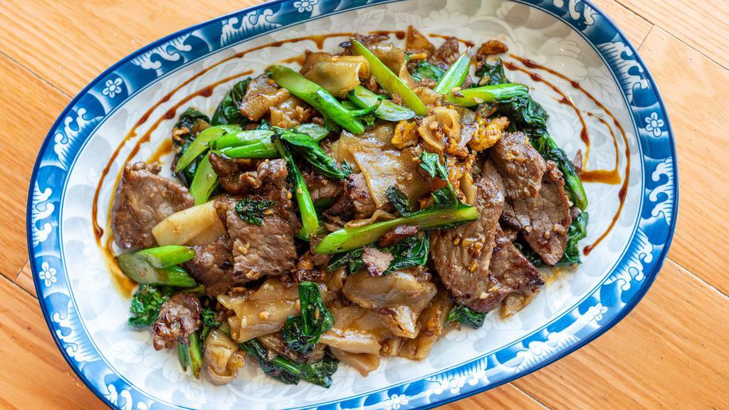Pad See Ew · Vegetarian, Gluten-free.Stir-fried broad flat rice noodles, Chinese broccoli & eggs in light brown sauce