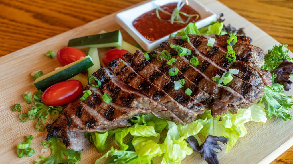 Crying Tiger (Flank Steak) · Gluten-free. Grilled marinated beef steak served with tamarind chili dipping sauce
