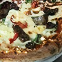 The Greek Pizza · Black olives, roasted red peppers, gyro meat, baby spinach, feta cheese, tomato sauce and mo...