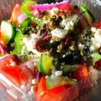 Greek Salad · Tomatoes, cucumbers, green peppers, red onions, capers, black olives, feta cheese, and extra...