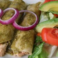 Green Chicken Enchiladas · 3 enchiladas filled with chicken then smothered with our tomatillo sauce, served with sliced...