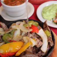 Personal Sizzling Fajita Skillet · Beef, chicken or combo fajitas served with three tortillas, guacamole, pico de gallo and bor...