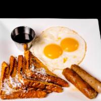 French Toast Breakfast · Served with two eggs and choice of bacon, ham or sausage links.