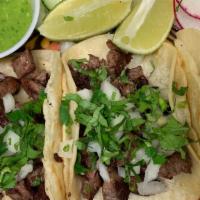 (2) Tacos - Grilled Steak · (2) TACOS W/ LIGHTLY MARINATED ANGUS GRILLED STEAK + TOPPINGS OF YOUR CHOICE. 
AVAILABLE TOP...
