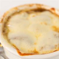 Baked Onion Soup · Topped with a crouton, Mozzarella, and Swiss Cheese.
