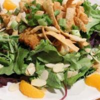 Crunchy Chinese Chicken Salad · Chopped garden greens topped with crispy breast of chicken, mandarin oranges and toasted alm...