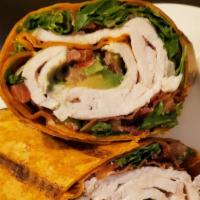 Chipotle Turkey Avocado Wrap · Sliced turkey with lettuce, tomatoes, bacon, avocado and our house made chipotle aioli serve...