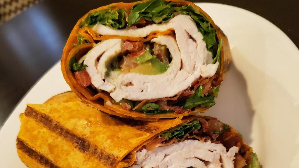 Chipotle Turkey Avocado Wrap · Sliced turkey with lettuce, tomatoes, bacon, avocado and our house made chipotle aioli served on a  wrap. Served with your choice of French fries or coleslaw.