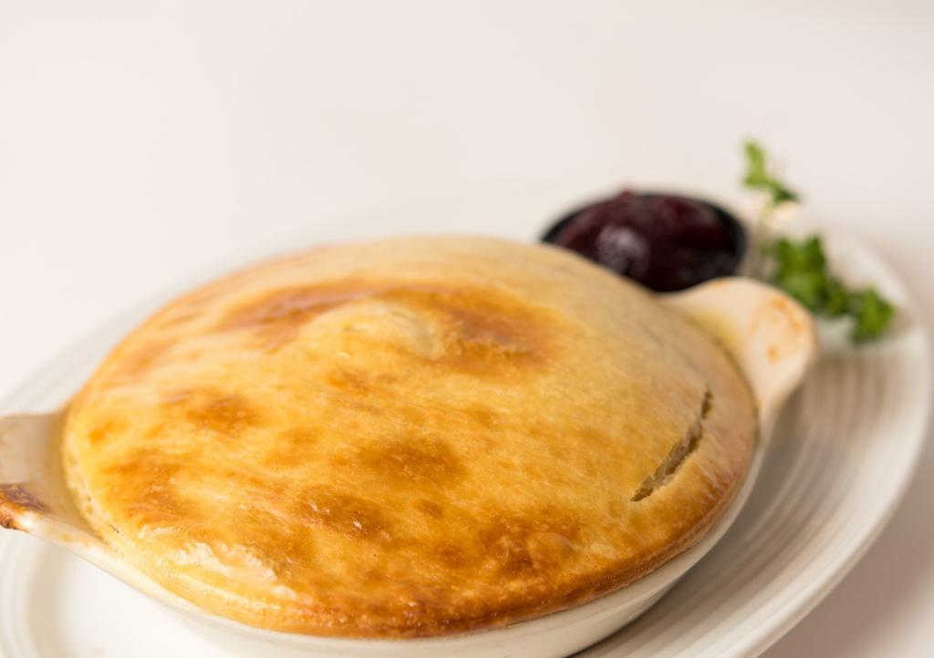 Chicken Pot Pie · Tender white chicken meat combined with garden vegetables and baked with a flaky, buttery pie crust. Served with cup of soup or salad.