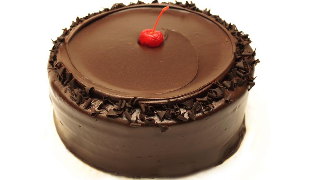 Wh Chocolate Layer Cake · Best in Rhode Island! Four layers of double, rich chocolate cake. Unusually moist sandwiched between rich, dark, chocolate frosting and sprinkled with chocolate curls.