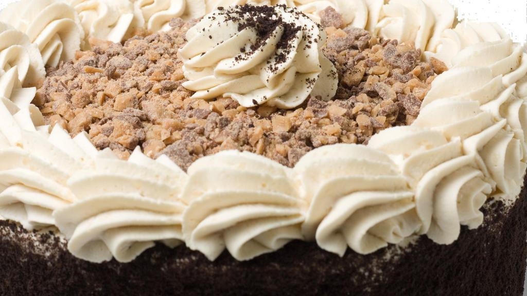 Wh Toffee Candy Crunch Cake · Four layers of toffee cake filled with coffee flavored whipped cream and sprinkles of heath® candy then topped with even more candy.