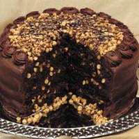 Wh Peanut Butter Choc Cake · Four layers of chocolate cake filled with peanut butter, frosted with chocolate frosting and...