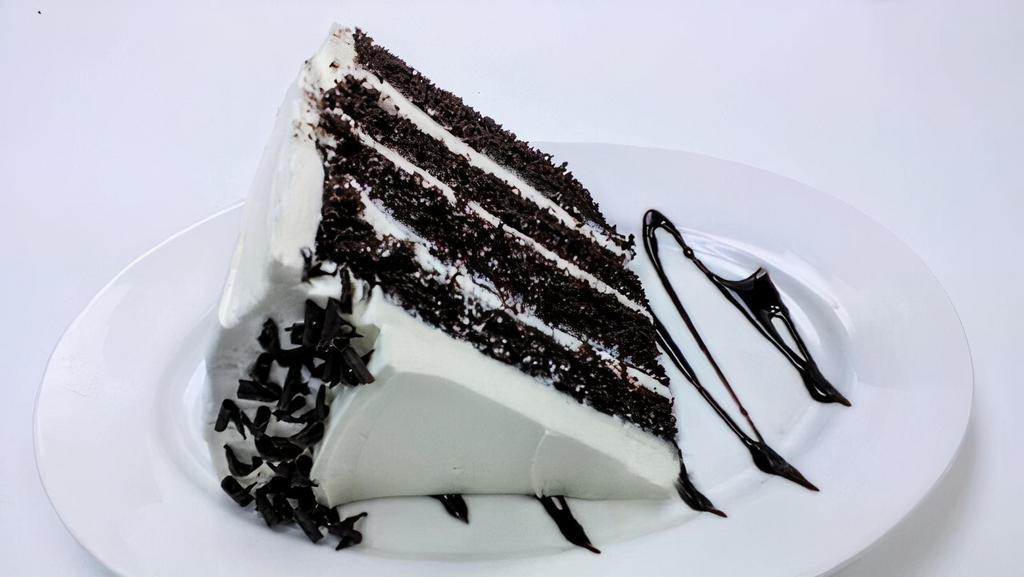 Wh Old Hollywood · Four layers of chocolate cake filled and finished with white butter cream frosting