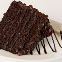 Slice Of Death By Chocolate · Six layers of chocolate cake filled and frosted with our chocolate frosting and covered in c...