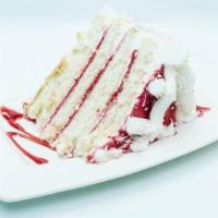 Slice Of Raspberry Coconut · Four layers of white cake filled with raspberry  filling and finished and frosted with cocon...