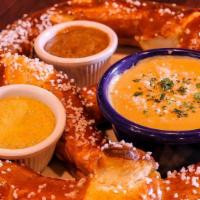 Bavarian Pretzel With Bier Cheese · Imported from Germany, served with house made warm Bavarian Cheese, paired sweet & spicy mus...
