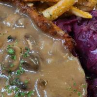 Chicken Schnitzel · Pounded chicken, breaded and fried golden, mushroom gravy, served with red cabbage & roasted...