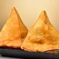 Samosa (2 Pc) · A samosa is a fried or baked triangular pastry with a savoury filling, such as spiced potato...