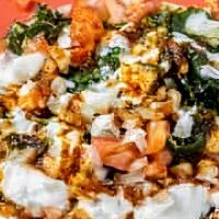 Palak Chat · Palak patta chaat recipe is crisp and fried spinach fritters topped with spicy green chutney...