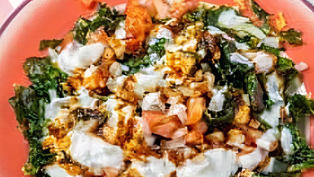 Palak Chat · Palak patta chaat recipe is crisp and fried spinach fritters topped with spicy green chutney, tangy and sweet tamarind dates chutney and onions, and spice mixes.