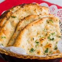 Garlic Naan · Garlic Naan is a type of naan bread, with minced garlic on top of the bread and baked in the...