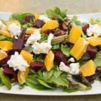Beet Salad · Organic greens, oven roasted beets, fresh orange, walnuts, Goat cheese, orange vinaigrette.