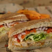 Chicken Sandwich · Grilled chicken breast, mozzarella cheese,. roasted peppers & red onions dressed with. lettu...