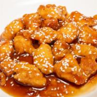 Sesame Chicken · Chunks of boneless chicken, breaded sauted with tangy and sweet brown sauce topped with sesa...
