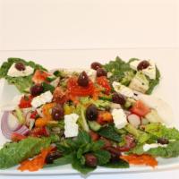 Greek Salad · Romaine lettuce, tomatoes, cucumbers, onions topped with black olives and feta cheese.