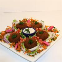 Falafel · Vegetarian. Chickpeas with lettuce, tomatoes, onions, pickles, radishes and tahini sauce.