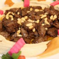 Hummus With Meat · Hummus topped with tender chopped beef and pine nuts.