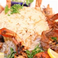 Shrimp Kabob · Marinated shrimp grilled to perfection, served with rice and vegetables.
