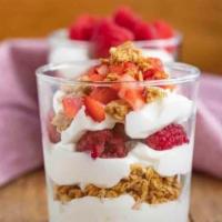 Yogurt Parfait · Blended strawberry banana yogurt with almond granola and fresh berries.