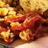 Breakfast Plate · Scrambled eggs, bacon or sausage, toast, served with seasoned potatoes or fresh seasonal fruit