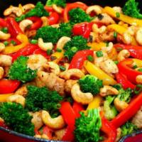 Chicken Vegetable Stir-Fry · With spaghetti noodles, broccoli, onions, bell peppers, mushrooms, cauliflower, snap peas an...
