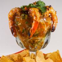 Seafood Campechana · Zesty lime-pineapple salsa topped with avocado, grilled shrimp, and jumbo lump crab meat, se...