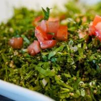 Tabbouleh Salad · Tomatoes, parsley, green onions, fresh mint, cracked wheat tossed with olive oil, and lemon ...