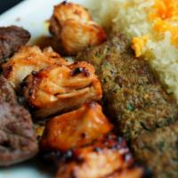 Kufta Kabob · 2 skewers of seasoned ground beef, served with creamy garlic sauce, saffron basmati rice, an...