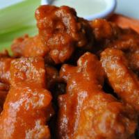Chicken Wings · Spicy. Fried chicken wings mixed with (buffalo sauce, BBQ or Thai sweet-sour sauce), carrots...