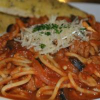 Spaghetti Veneto · Spaghetti, Italian sausage, olive oil, garlic, tomatoes, red onions, mushrooms, olives, mari...