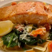 New Item* Salmon Specialty · Baked salmon (8 oz.) over fettucine pasta sautéed with garlic, fresh herbs, diced tomatoes, ...