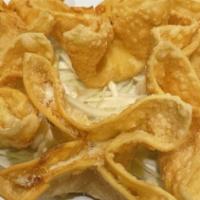 Crispy Rangoon · Silky mixture of cream cheese Ina crispy fried wonton. (6)