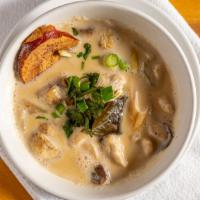Large Tom Kha Soup (Coconut Soup) · Our signature coconut milk-based soup with galangal root, lemongrass, mushroom, onion, and c...