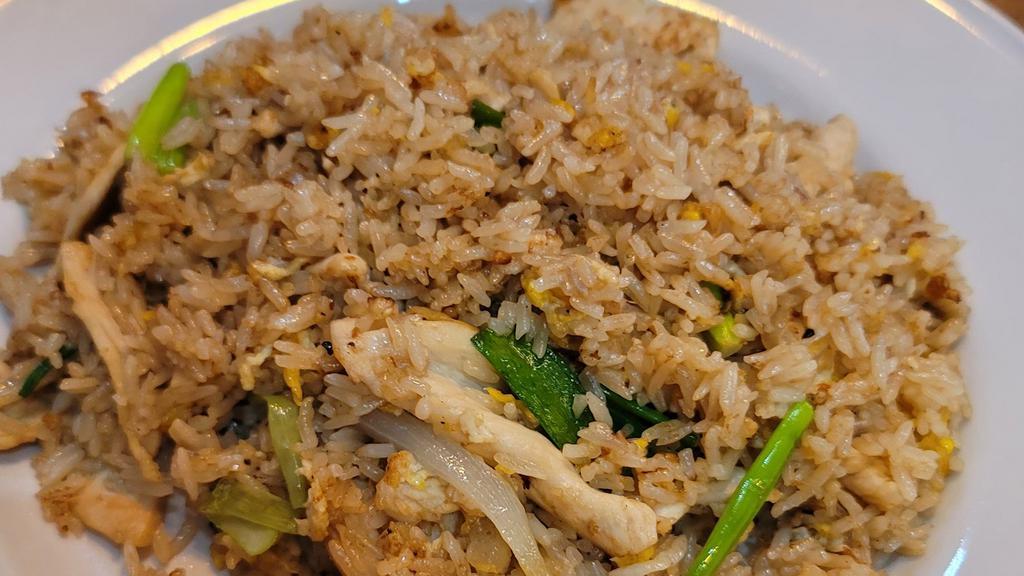 Fried Rice · Our classic fried rice stir-fried with scrambled egg, onions, scallions.

Picture shown chicken fried rice.