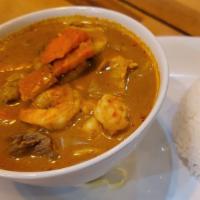 Yellow Curry (Spicy) · Mellow sweet and spicy yellow curry mixed with coconut milk, onions potatoes and carrots.